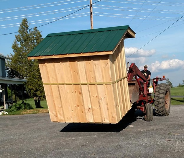 Moving the farm stand into place.
